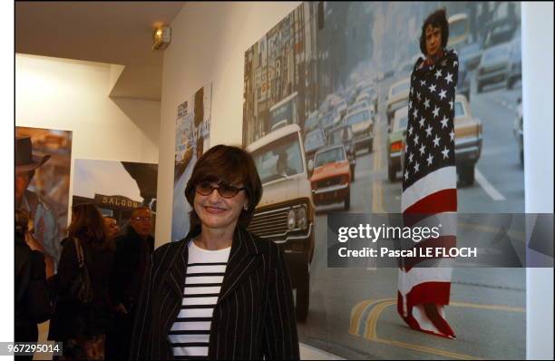 Anne Marie Perier in front of the Michel Sardou picture.