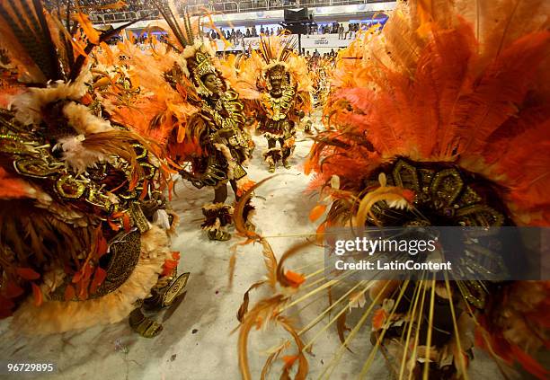 Members of Beija Flor samba school dance along on their parade as part of the 2010 Carnival on February 15, 2010 in Rio de Janeiro, Brazil.