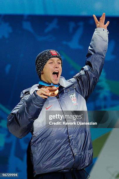 Bryon Wilson of the United States celebrates with the bronze medal during the medal ceremony for the Freestyle Skiing Men's Moguls on day 4 of the...