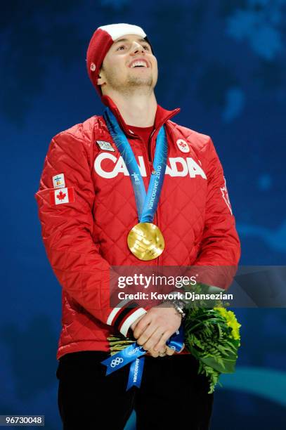 Alexandre Bilodeau of Canada celebrates after receiving the gold medal during the medal ceremony for winning the gold in the Freestyle Skiing Men's...