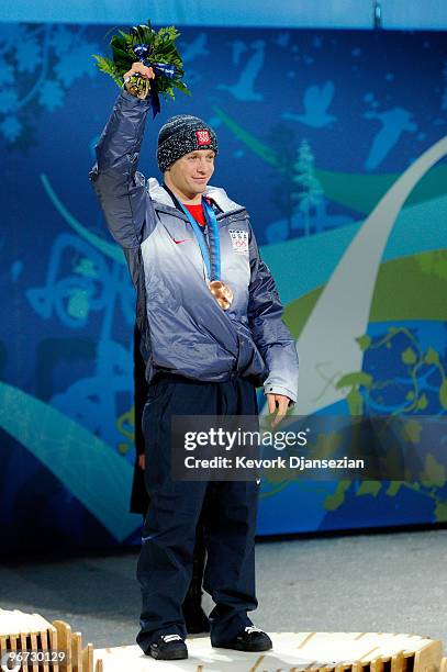 Bryon Wilson of the United States celebrates with the bronze medal during the medal ceremony for the Freestyle Skiing Men's Moguls on day 4 of the...