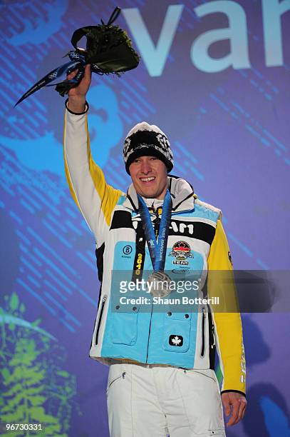 David Moeller of Germany celebrates winning the silver medal during the medal ceremony for the men�s luge singles at Whistler Medal Plaza on day 4 of...