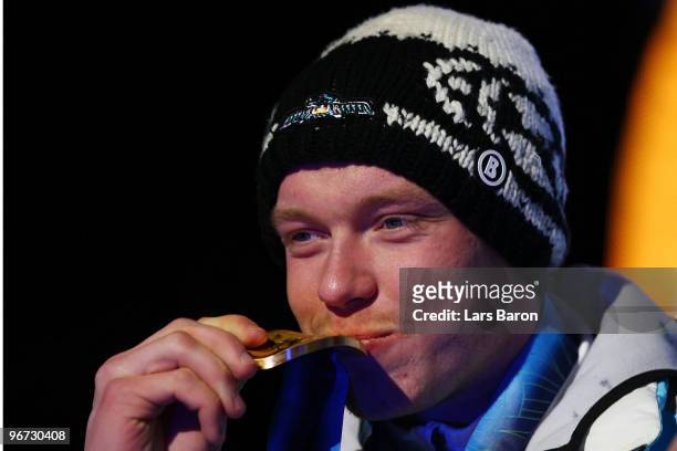 Felix Loch of Germany celebrates with the gold medal during the medal ceremony for the men�s luge singles at Whistler Medal Plaza on day 4 of the...