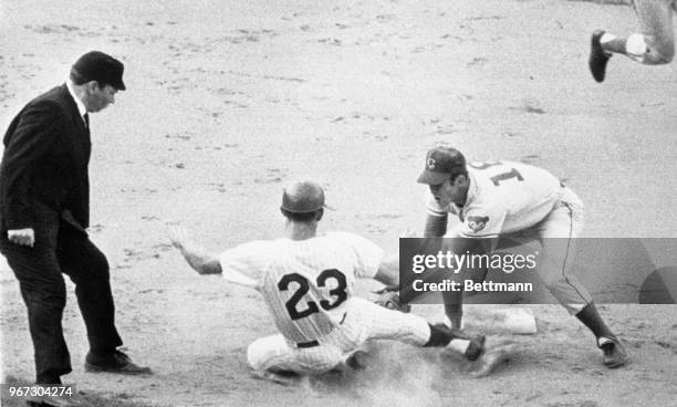 Second baseman, Glenn Beckert, tags out the Phillies Don Lock, who was attempting to steal during the first inning.