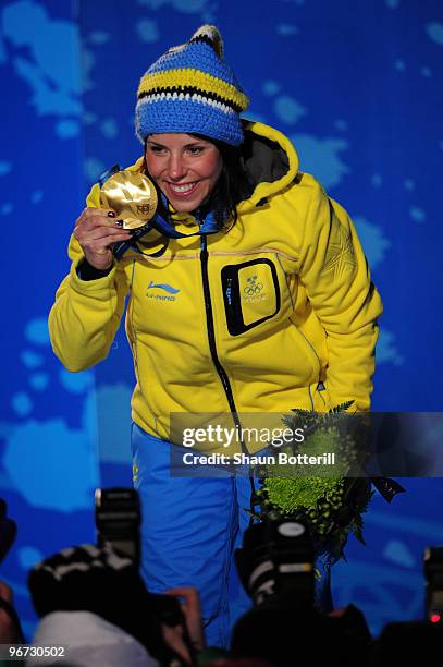 Charlotte Kalla of Sweden celebrates with the gold medal during the medal ceremony for the Cross-Country Skiing Ladies' 10 km Free at Whistler Medals...