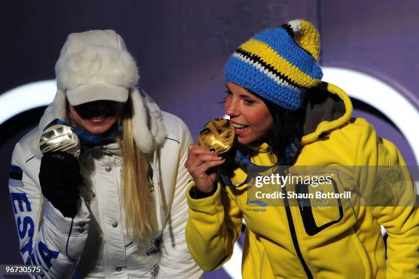 Kristina Smigun-Vaehi of Estonia poses with the silver medal and Charlotte Kalla of Sweden poses with the gold medal during the medal ceremony for...