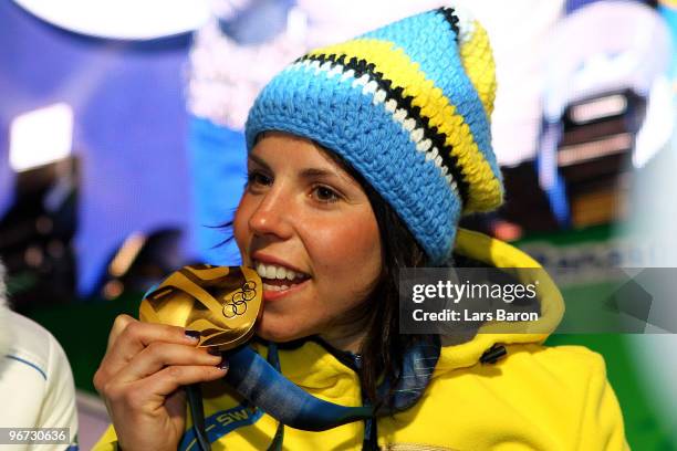 Charlotte Kalla of Sweden celebrates with the gold medal during the medal ceremony for the Cross-Country Skiing Ladies' 10 km Free at Whistler Medals...