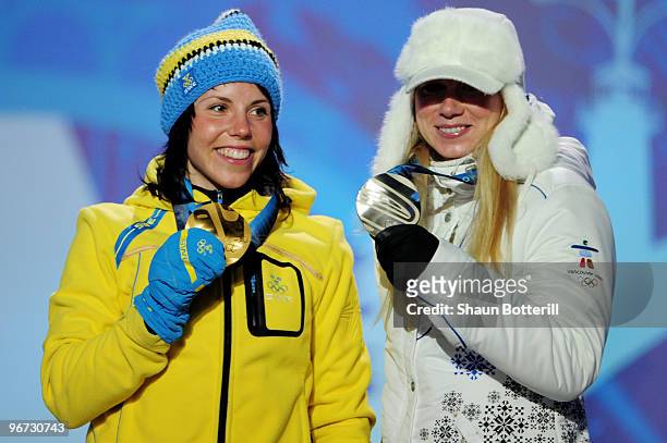 Charlotte Kalla of Sweden poses with the gold medal and Kristina Smigun-Vaehi of Estonia poses with the silver medal during the medal ceremony for...