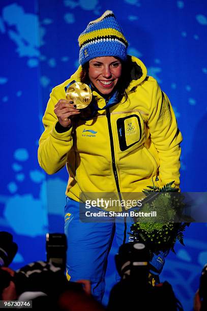 Charlotte Kalla of Sweden celebrates with the gold medal during the medal ceremony for the Cross-Country Skiing Ladies' 10 km Free at Whistler Medals...