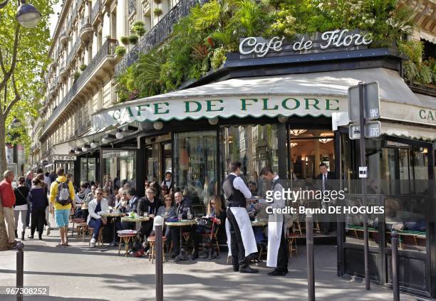 Waiters of Cafe de Flore in Saint Germain des Pres Boulevard, Montparnasse district on April 2011 in Paris, France.