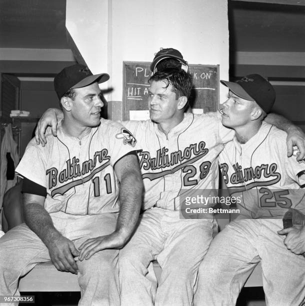 Baltimore Orioles' pitcher Skinny Brown, who blanked the New York Yankees on six hits is flanked by teammates Gus Triandos and Jackie Brandt in the...