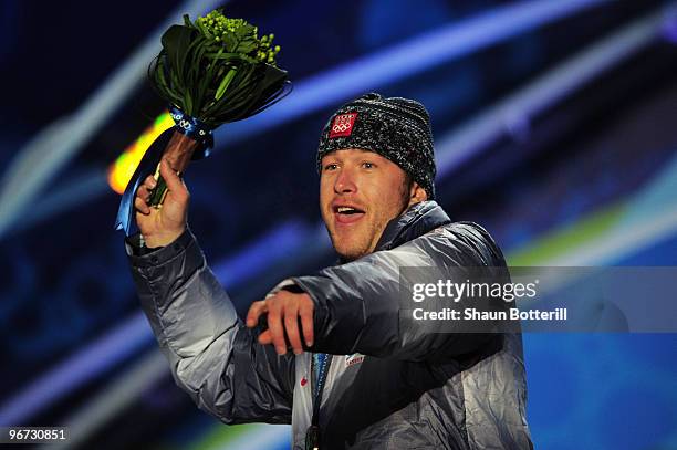 Bode Miller of the United States celebrates with the bronze at the medal ceremony for the Alpine skiing Men's Downhill at Whistler Medal Plaza during...