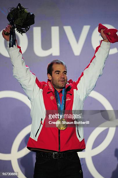 Didier Defago of Switzerland poses with the gold medal at the medal ceremony for the Alpine skiing Men's Downhill at Whistler Medal Plaza during the...