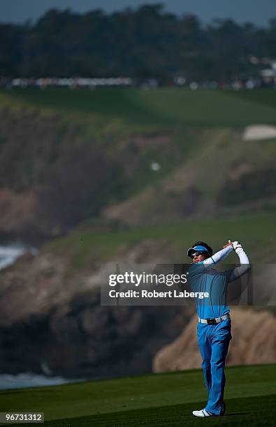 Ryo Ishikawa of Japan makes an approach shot on the tenth hole during the third round of the AT&T Pebble Beach National Pro-Am at the Pebble Beach...