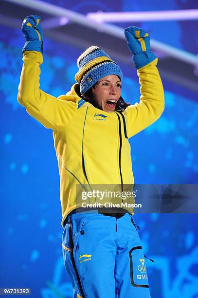 Charlotte Kalla of Sweden celebrates before receiving the gold medal during the medal ceremony for the Cross-Country Skiing Ladies' 10 km Free at...