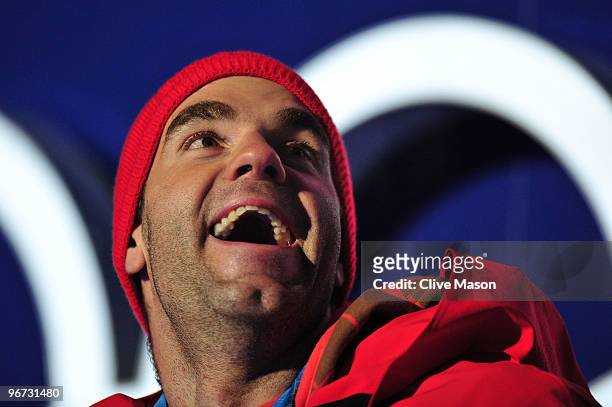 Didier Defago of Switzerland celebrates with the gold medal at the medal ceremony for the Alpine skiing Men's Downhill at Whistler Medal Plaza during...