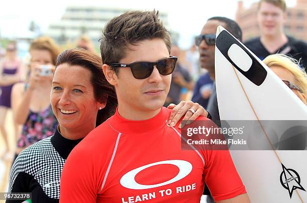 Australian Surf Legend Layne Beachley and Zac Efron pose for a photo at the Oakley's "Learn To Ride" charity learn-to-surf event in aid of the One...