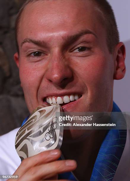 David Moeller of Germany celebrates with the silver medal for the men's luge singles at the German house on day 4 of the Vancouver 2010 Winter...