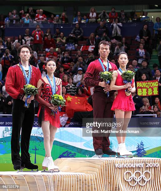 Jian Tong and Qing Pang of China win the silver medal, Hongbo Zhao and Xue Shen of China win the gold medal in the Figure Skating Pairs Free Program...