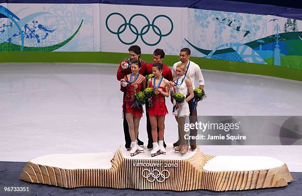 Jian Tong and Qing Pang of China win the silver medal, Hongbo Zhao and Xue Shen of China win the gold medal, and Robin Szolkowy and Aliona Savchenko...