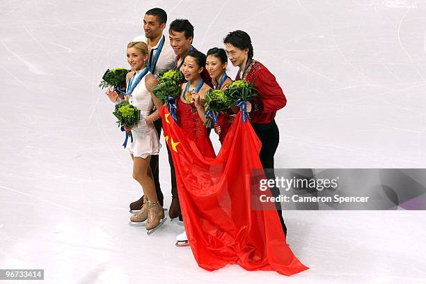 Aliona Savchenko and Robin Szolkowy of Germany win the bronze medal, Hongbo Zhao and Xue Shen of China win the gold medal, and Qing Pang and Jian...