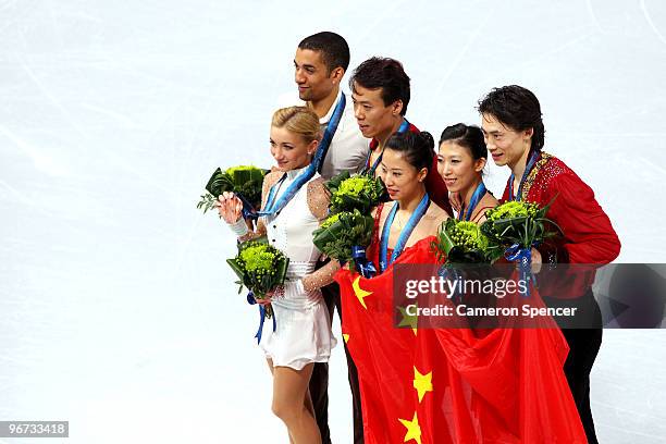 Aliona Savchenko and Robin Szolkowy of Germany win the bronze medal, Hongbo Zhao and Xue Shen of China win the gold medal, and Qing Pang and Jian...