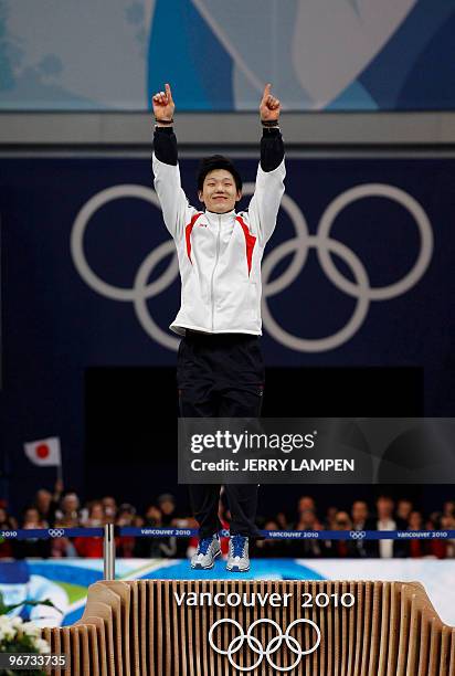 Gold medal winner South Korea's Mo Tae-Bum celebrates victory in the men's Speed Skating 500 meters at Richmond Olympic Oval on February 15, 2010...