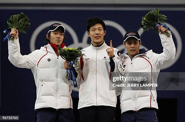 Gold medal winner South Korea's Mo Tae-Bum , silver Medalist Japan's Keiichiro Nagashima and bronze medal winner Japan's Joji Kato celebrate victory...