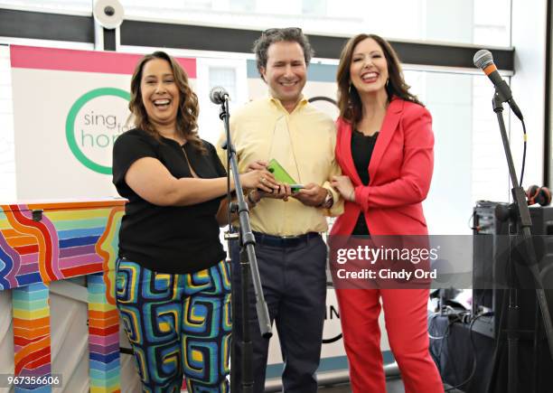 Sing For Hope co-founders Monica Yunus and Camille Zamora pose for a photo with Lee Nadler, Marketing Communications & Launch Manager, MINI USA as...