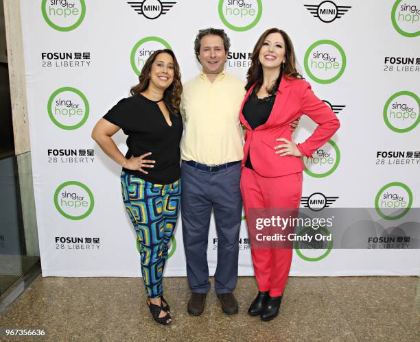 Sing For Hope co-founders Monica Yunus and Camille Zamora pose for a photo with Lee Nadler, Marketing Communications & Launch Manager, MINI USA as...