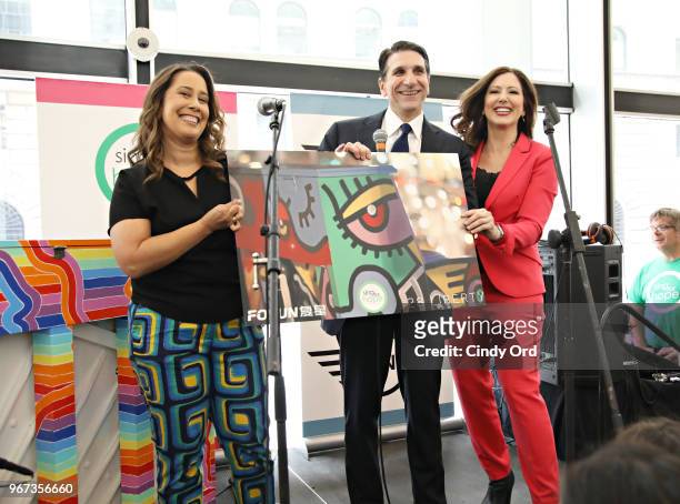Sing For Hope co-founders Monica Yunus and Camille Zamora pose for a photo with Tom Costanzo, Managing Director, Fosun Property Holdings as the 2018...
