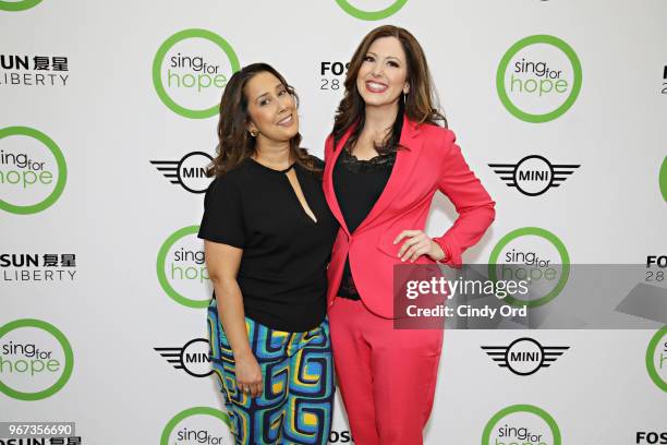 Sing For Hope co-founders Monica Yunus and Camille Zamora pose for a photo as The 2018 Sing for Hope Pianos are unveiled at 28 Liberty on June 4,...