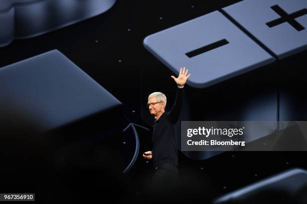 Tim Cook, chief executive officer of Apple Inc., waves after speaking during the Apple Worldwide Developers Conference in San Jose, California, U.S.,...