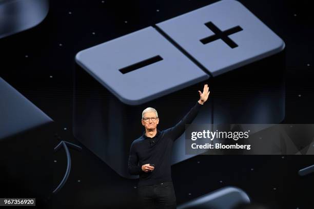 Tim Cook, chief executive officer of Apple Inc., waves after speaking during the Apple Worldwide Developers Conference in San Jose, California, U.S.,...