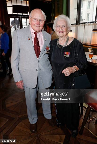 Basil Lambert and wife attend a charity auction, held at The Wigmore in partnership with the Royal British Legion, to celebrate the release of...