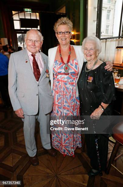 Basil Lambert and wife posing with guest attend a charity auction, held at The Wigmore in partnership with the Royal British Legion, to celebrate the...