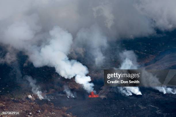 Lava from the Kilauea Volcano burns along the East Rift Zone which runs through Leilani Estates on the Big Island on June 1, 2018 in Pahoa, Hawaii....