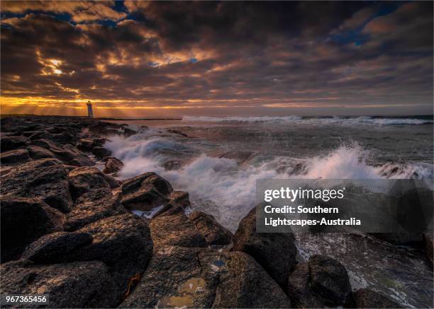 stormy dawn on griffitt island, port fairy, victoria, australia. - bass strait stockfoto's en -beelden