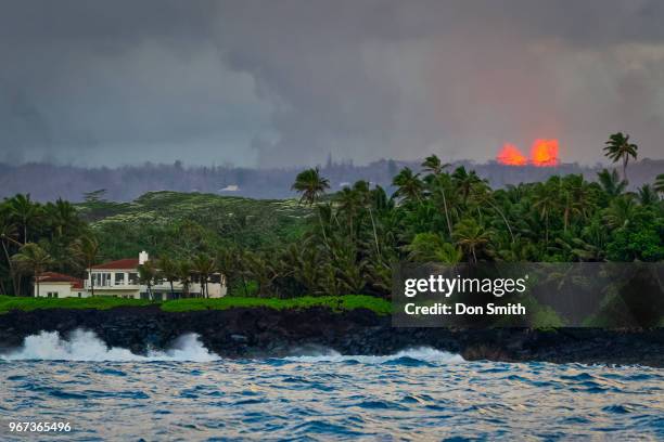 Lava erupts from Fissure 8 Fountain in Leilani Estates as seen from the Kapoho coast on the east side of the Big Island of Hawaii on May 31, 2018 in...