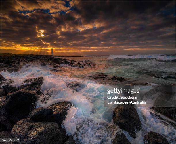 stormy dawn on griffitt island, port fairy, victoria, australia. - bass strait stock pictures, royalty-free photos & images