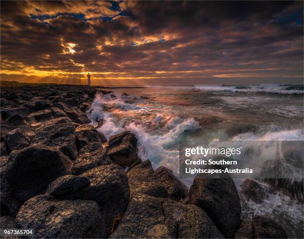 stormy dawn on griffitt island, port fairy, victoria, australia. - bass strait stockfoto's en -beelden