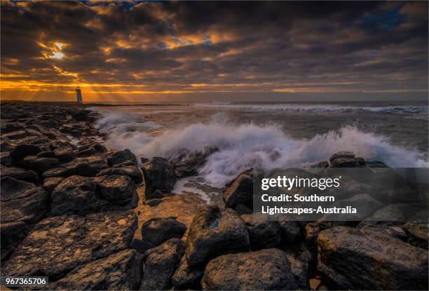 stormy dawn on griffitt island, port fairy, victoria, australia. - bass strait stockfoto's en -beelden