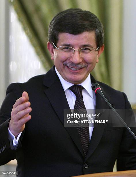 Turkish Foreign Minister Ahmet Davutoglu speaks during a joint press conference with his Iranian counterpart Manouchehr Mottaki following a meeting...
