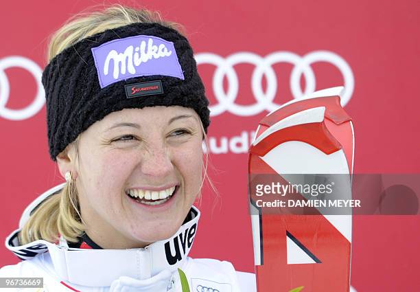 Austria's Michaela Kirchgasser smiles on the podium of the FIS alpine ski world cup super combined on January 29, 2010 in Saint Moritz. Sweden's Anja...
