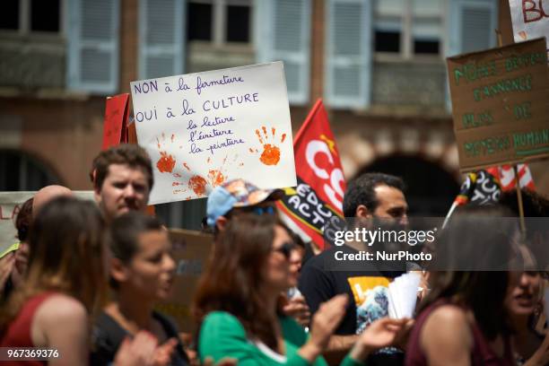 Placard reads 'No to the closing, yes to culture, reading, writing, painting'. Primary school teachers and parents'pupils gathered and demonstrated...