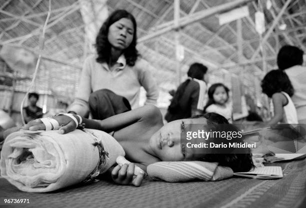 Cambodian refugees in a hospital in a refugee camp set up by the UNHCR in Thailand, near the border with Cambodia, 1987. In November 1978, Vietnam...