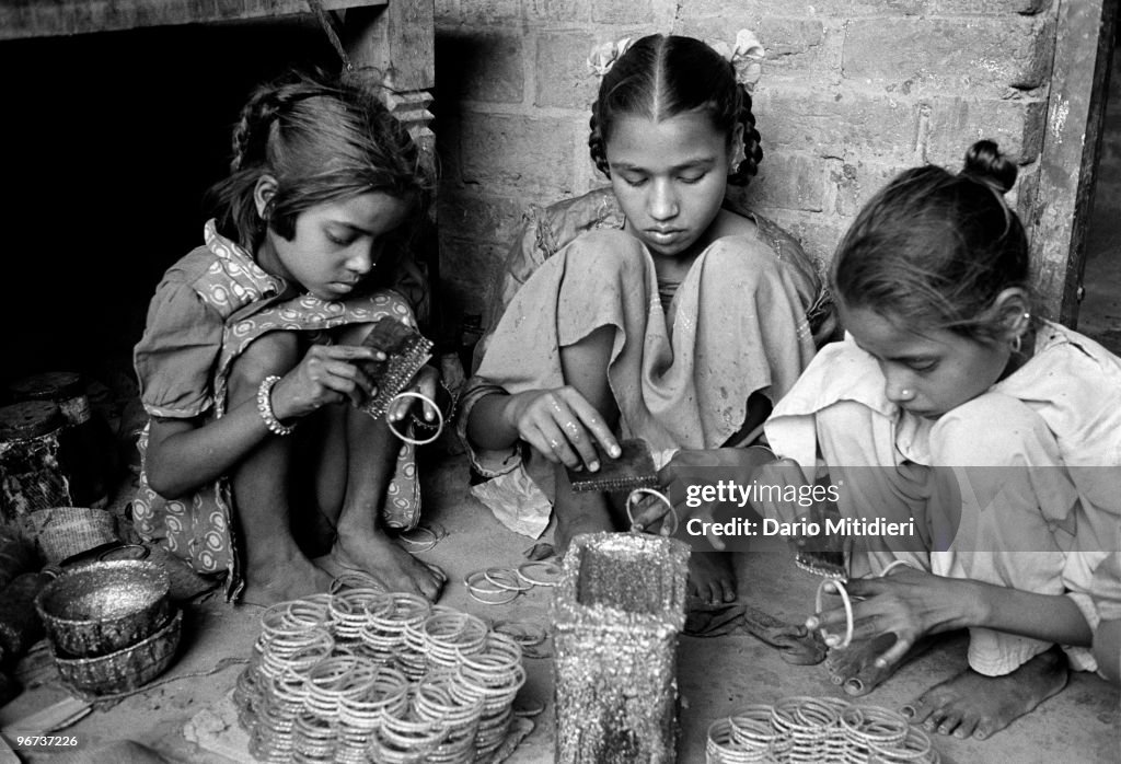 Bangles Factory Children making glass bangles in Firozabad, India, 2003. Despite a ...
