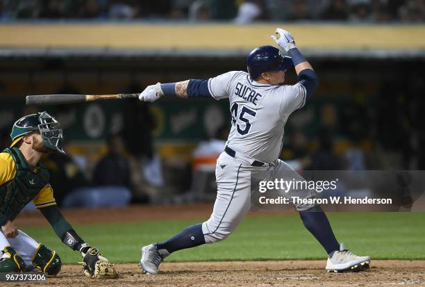 Jesus Sucre of the Tampa Bay Rays bats against the Oakland Athletics in the top of the six inning at the Oakland Alameda Coliseum on May 30, 2018 in...