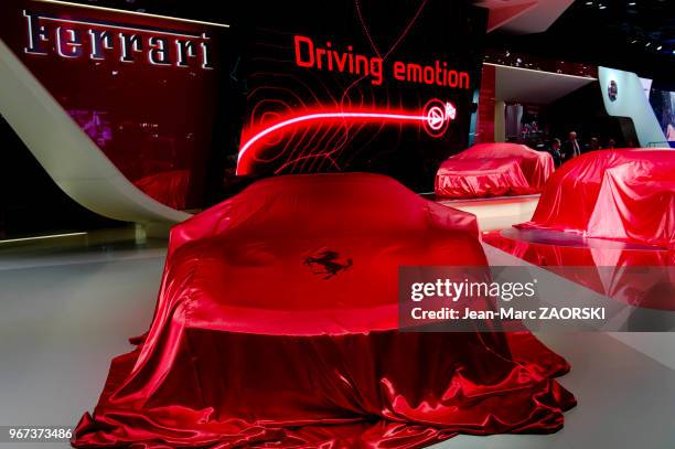 Slogan insistant sur le côté émotionnel de la marque italienne, stand Ferrari, lors du Mondial de l'Automobile le 29 septembre 2016, à Paris, France.