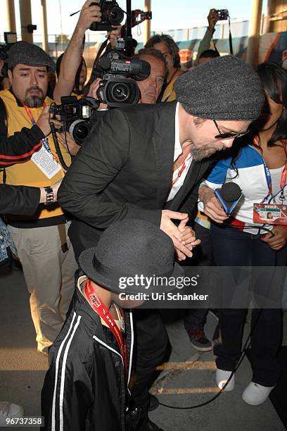 Brad Pitt and his son Maddox Jolie-Pitt arrive at Super Bowl XLIV at Sun Life Stadium on February 7, 2010 in Miami Gardens, Florida.